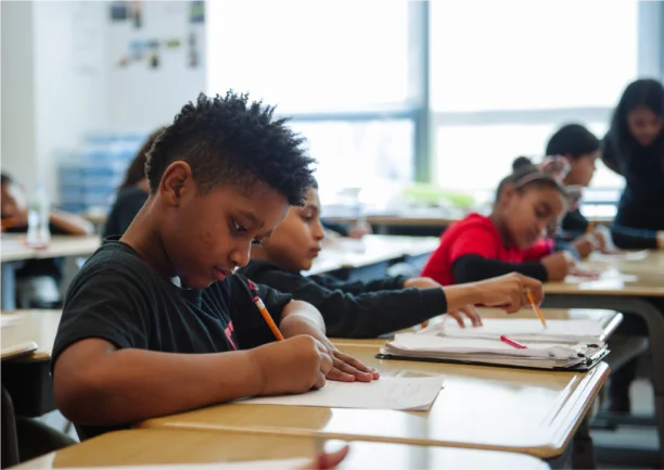 student writing at desk