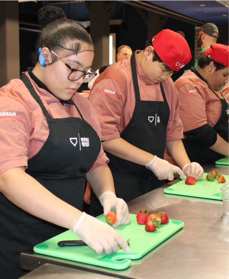 students prepping strawberries